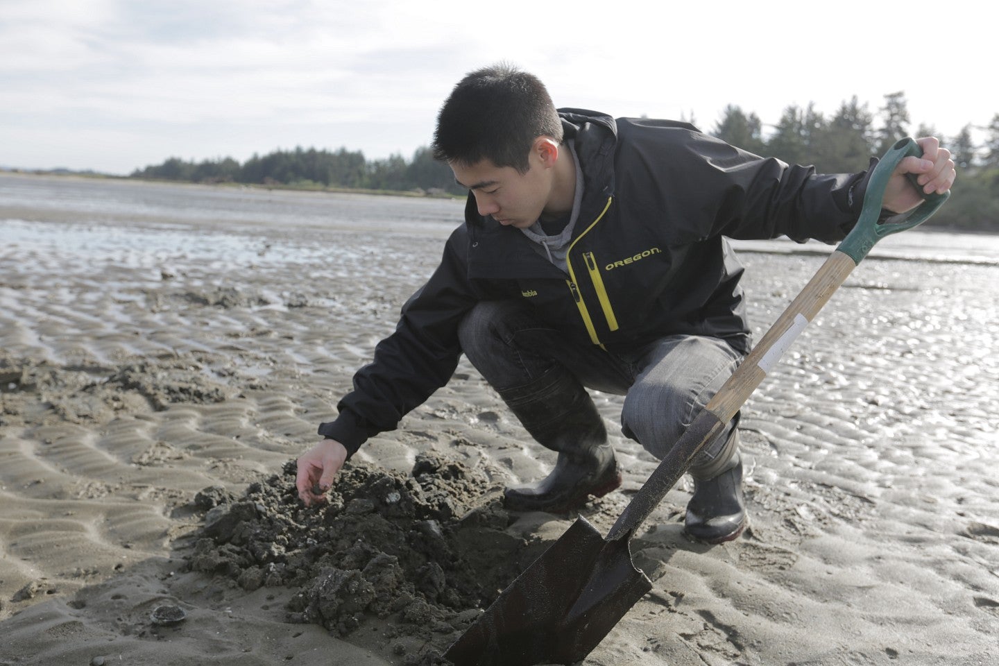 student conducts research on beach